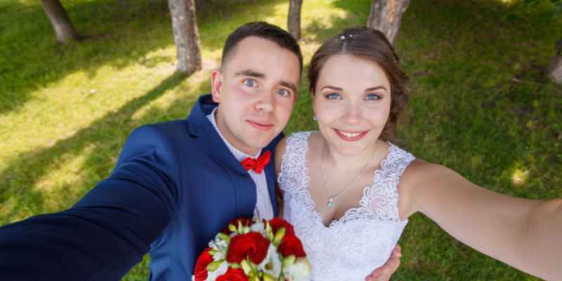 Bride and groom taking selfie