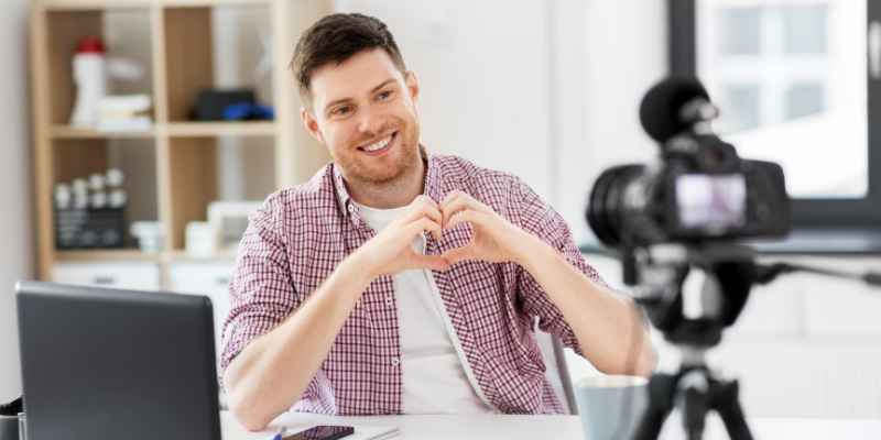 Man making a heart gesture