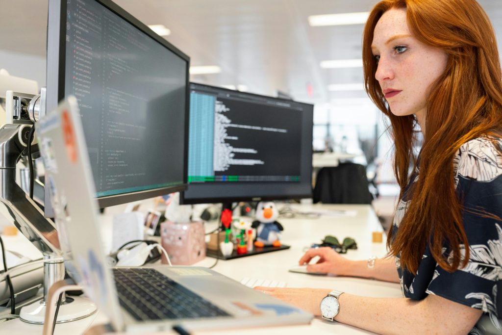 Woman coding at a desk